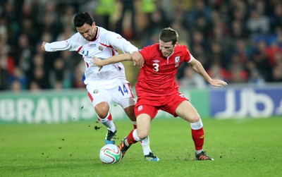 290212 - Wales v Costa Rica, The Gary Speed Memorial Match, Cardiff - Wales' Adam Matthews tangles with Costa Rica's Randall Azofeifa  