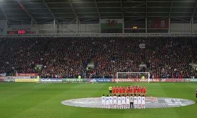 290212 - Wales v Costa Rica, The Gary Speed Memorial Match, Cardiff - The teams participate in a minutes applause at the start of the match  