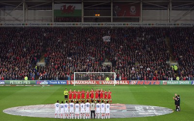290212 - Wales v Costa Rica, The Gary Speed Memorial Match, Cardiff - The teams participate in a minutes applause at the start of the match  