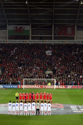 290212 - Wales v Costa Rica, The Gary Speed Memorial Match, Cardiff - The teams participate in a minutes applause at the start of the match  