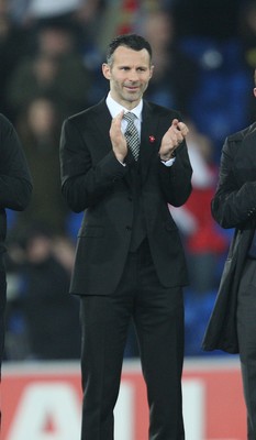 290212 - Wales v Costa Rica, The Gary Speed Memorial Match, Cardiff - Ryan Giggs is amongst the former Welsh players to honour Gary Speed at half time 