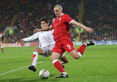 290212 - Wales v Costa Rica, The Gary Speed Memorial Match, Cardiff - Wales' Steve Morrison is challenged by Costa Rica's Jose Salvatierra 