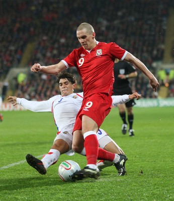 290212 - Wales v Costa Rica, The Gary Speed Memorial Match, Cardiff - Wales' Steve Morrison is challenged by Costa Rica's Jose Salvatierra 