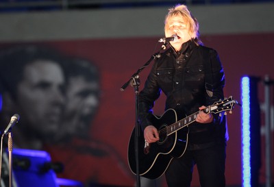 290212 - Wales v Costa Rica, The Gary Speed Memorial Match, Cardiff - Mike Peters performs before the start of the match 