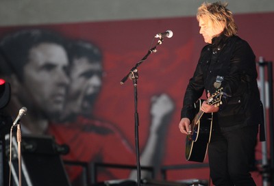 290212 - Wales v Costa Rica, The Gary Speed Memorial Match, Cardiff - Mike Peters performs before the start of the match 