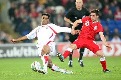 290212 - Wales v Costa Rica, The Gary Speed Memorial Match, Cardiff - Wales' Joe Allen and Costa Rica's Michael Umana compete for the ball