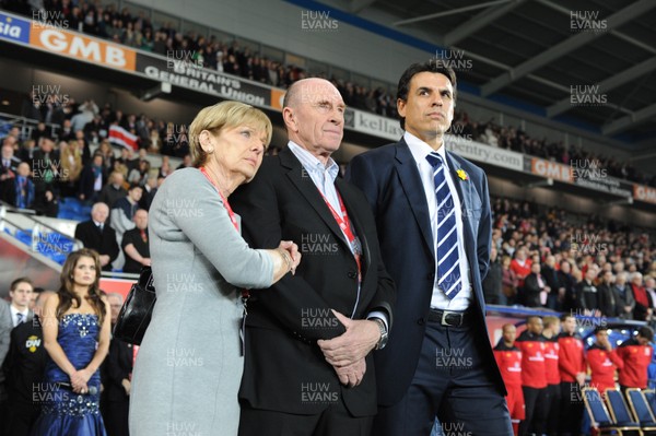 290212 - Wales v Costa Rica -Wales manager Chris Coleman looks on during the national anthems with Gary Speed's parents Roger and Carol