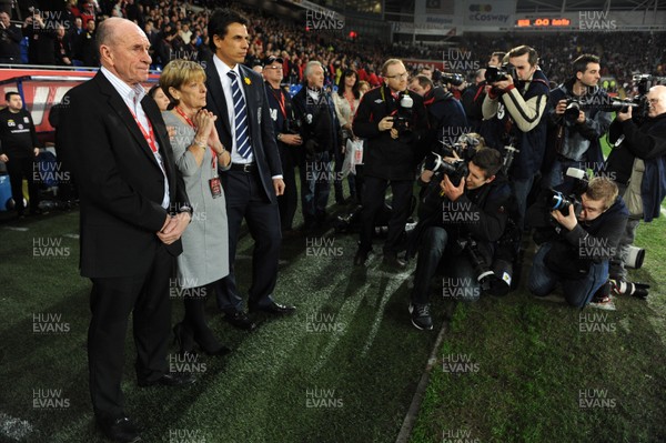 290212 - Wales v Costa Rica -Wales manager Chris Coleman looks on during the national anthems with Gary Speed's parents Roger and Carol