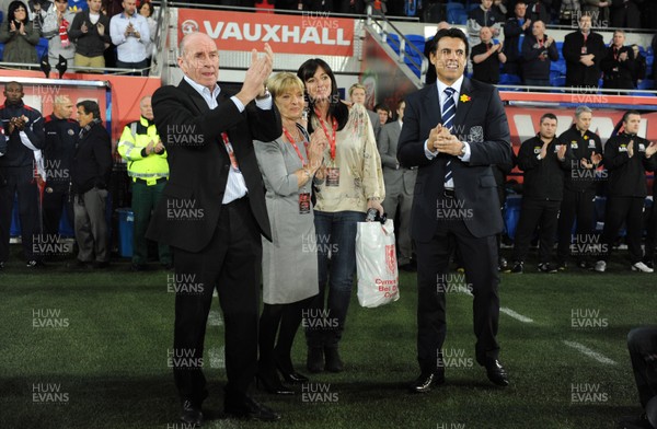 290212 - Wales v Costa Rica -Wales manager Chris Coleman looks on during the national anthems with Gary Speed's parents Roger and Carol and sister Louise Haylock(centre)