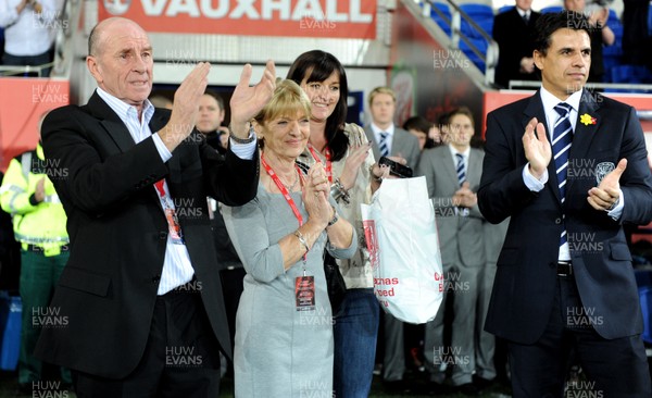 290212 - Wales v Costa Rica -Wales manager Chris Coleman looks on during the national anthems with Gary Speed's parents Roger and Carol and sister Louise Haylock(centre)