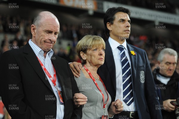290212 - Wales v Costa Rica -Wales manager Chris Coleman looks on during the national anthems with Gary Speed's parents Roger and Carol