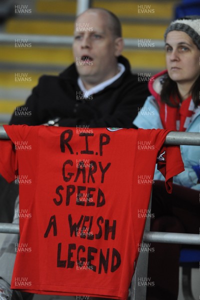 290212 - Wales v Costa Rica -Wales fans look on with a Gary Speed message