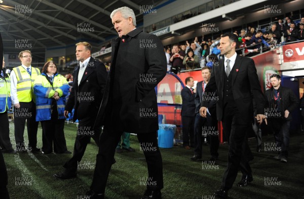 290212 - Wales v Costa Rica -Mark Hughes and Ryan Giggs walk onto the pitch during half time of the Gary Speed memorial match