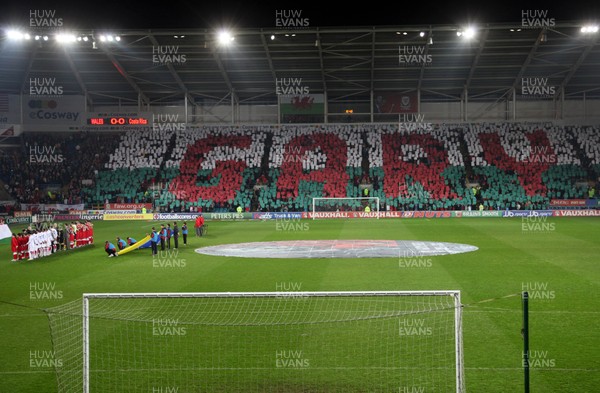 290212 - Wales v Costa Rica, The Gary Speed Memorial Match, Cardiff - Fans spell out Gary's name during the singing of the National Anthem at the start of the match 