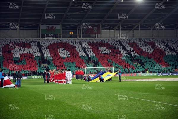 290212 - Wales v Costa Rica, The Gary Speed Memorial Match, Cardiff - Fans spell out Gary's name during the singing of the National Anthem at the start of the match 