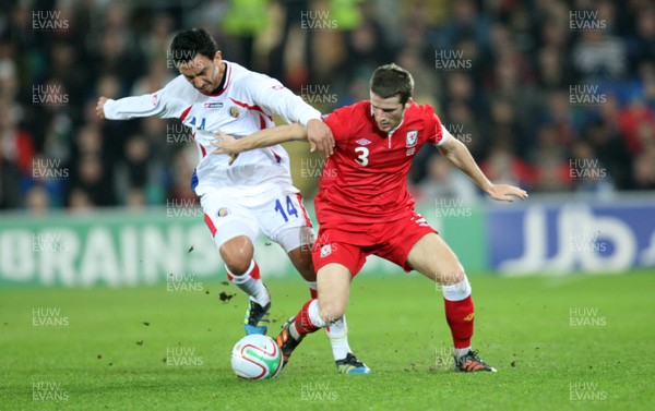 290212 - Wales v Costa Rica, The Gary Speed Memorial Match, Cardiff - Wales' Adam Matthews tangles with Costa Rica's Randall Azofeifa  