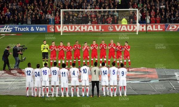 290212 - Wales v Costa Rica, The Gary Speed Memorial Match, Cardiff - The teams participate in a minutes applause at the start of the match  