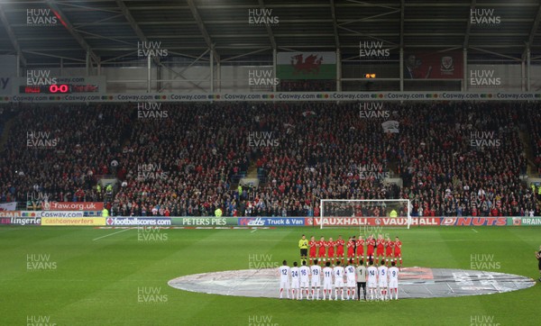 290212 - Wales v Costa Rica, The Gary Speed Memorial Match, Cardiff - The teams participate in a minutes applause at the start of the match  