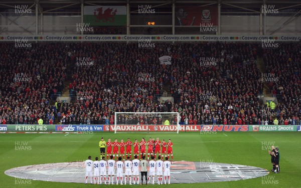 290212 - Wales v Costa Rica, The Gary Speed Memorial Match, Cardiff - The teams participate in a minutes applause at the start of the match  