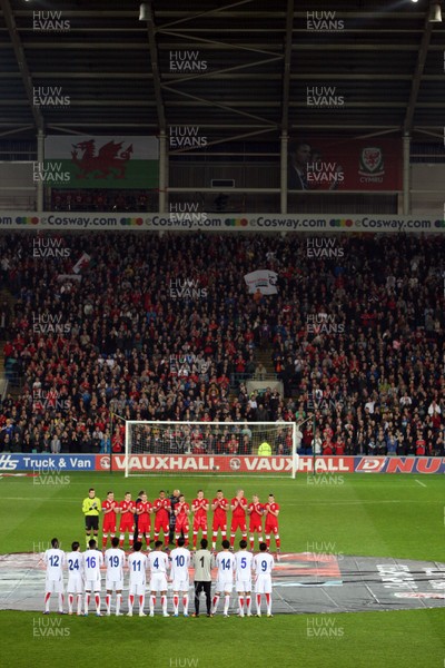290212 - Wales v Costa Rica, The Gary Speed Memorial Match, Cardiff - The teams participate in a minutes applause at the start of the match  