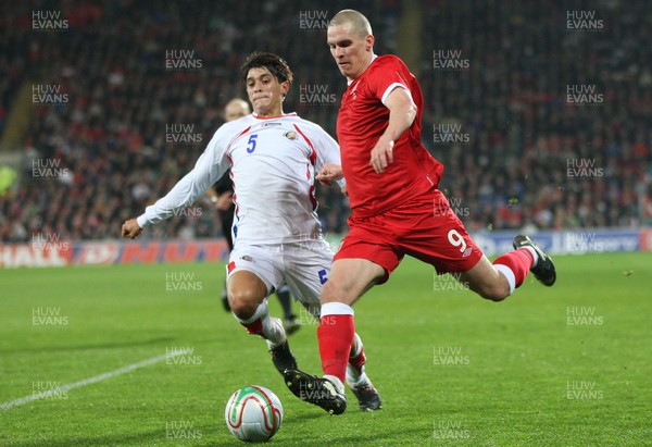 290212 - Wales v Costa Rica, The Gary Speed Memorial Match, Cardiff - Wales' Steve Morrison is challenged by Costa Rica's Jose Salvatierra 