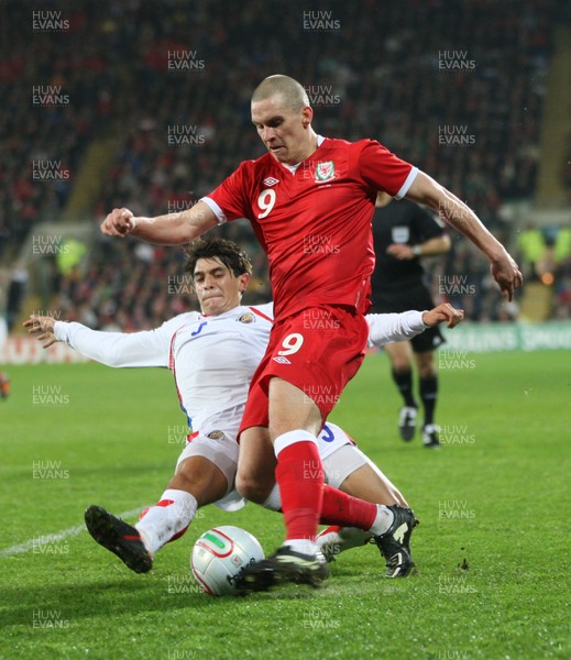 290212 - Wales v Costa Rica, The Gary Speed Memorial Match, Cardiff - Wales' Steve Morrison is challenged by Costa Rica's Jose Salvatierra 