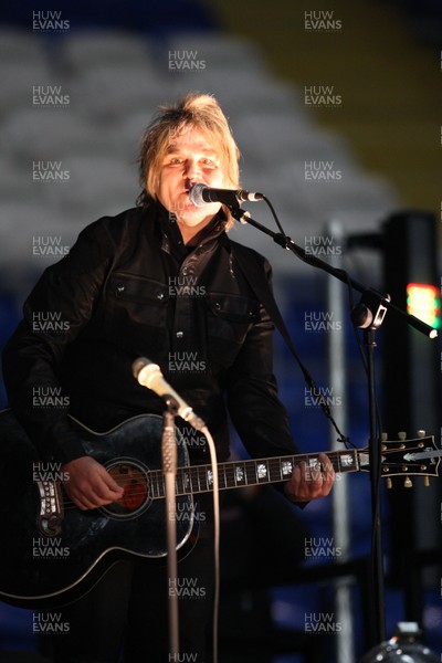290212 - Wales v Costa Rica, The Gary Speed Memorial Match, Cardiff - Mike Peters performs before the start of the match 