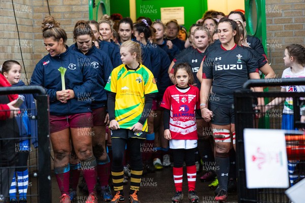 231119 - Wales Women v Crawshay's Women - Siwan Lillicrap of Wales (R) waits to lead Wales out