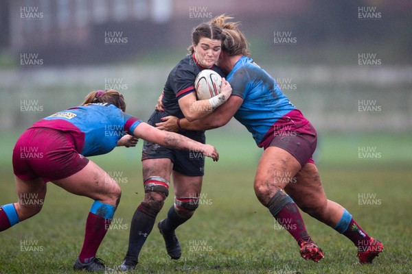 231119 - Wales Women v Crawshay's Women - Robyn Lock of Wales is tackled by  Emily Tuttosi and Shona Powell-Hughes