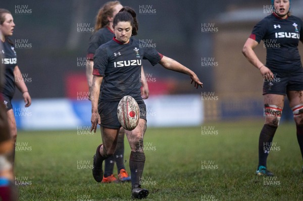 231119 - Wales Women v Crawshay's Women - Robyn Wilkins of Wales kicks for touch