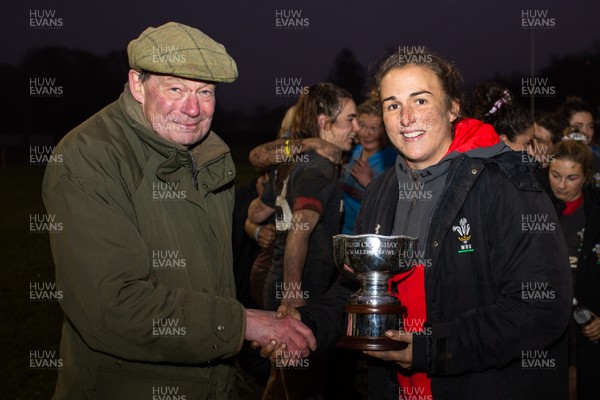 231119 - Wales Women v Crawshay's Women - The Chairman of Crawshay's RFC presents the Rose Crawshay Challenge Trophy to Siwan Lillicrap of Wales