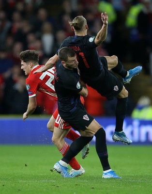 131019 - Wales v Croatia - European Championship Qualifiers - Group E - Daniel James of Wales falls to the ground after colliding with Domagoj Vida of Croatia