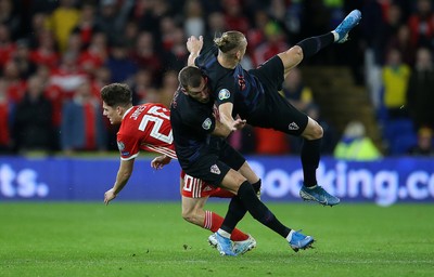 131019 - Wales v Croatia - European Championship Qualifiers - Group E - Daniel James of Wales falls to the ground after colliding with Domagoj Vida of Croatia