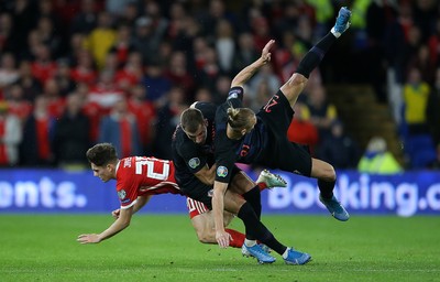 131019 - Wales v Croatia - European Championship Qualifiers - Group E - Daniel James of Wales falls to the ground after colliding with Domagoj Vida of Croatia