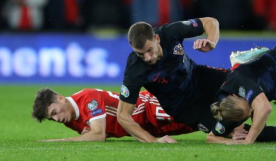 131019 - Wales v Croatia - European Championship Qualifiers - Group E - Daniel James of Wales falls to the ground after colliding with Domagoj Vida of Croatia