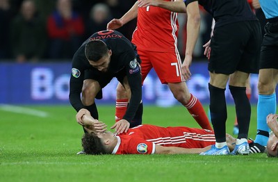 131019 - Wales v Croatia - European Championship Qualifiers - Group E - Daniel James of Wales falls to the ground after colliding with Domagoj Vida of Croatia