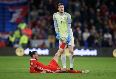 131019 - Wales v Croatia - European Championship Qualifiers - Group E - Wales goalkeeper Wayne Hennessey helps Gareth Bale