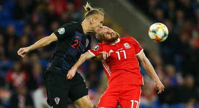 131019 - Wales v Croatia, UEFA Euro 2020 Qualifier - Domagoj Vida of Croatia and Jonny Williams of Wales compete for the ball