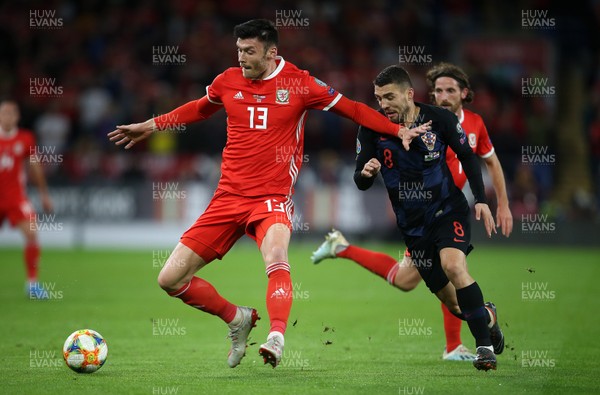 131019 - Wales v Croatia - European Championship Qualifiers - Group E - Kieffer Moore of Wales is challenged by Mateo Kovacic of Croatia