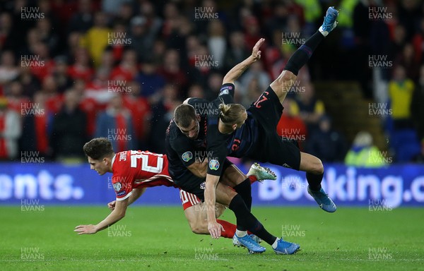 131019 - Wales v Croatia - European Championship Qualifiers - Group E - Daniel James of Wales falls to the ground after colliding with Domagoj Vida of Croatia