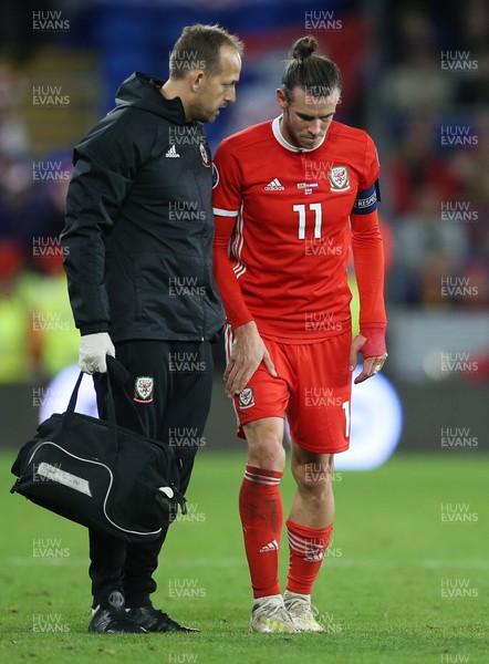 131019 - Wales v Croatia - European Championship Qualifiers - Group E - Gareth Bale of Wales talks to medics as he's seen limping