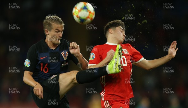 131019 - Wales v Croatia, UEFA Euro 2020 Qualifier - Tin Jedvaj of Croatia clears the ball as Daniel James of Wales challenges