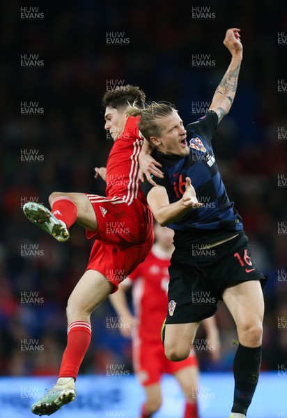 131019 - Wales v Croatia, UEFA Euro 2020 Qualifier - Daniel James of Wales and Tin Jedvaj of Croatia collide as they compete for the ball