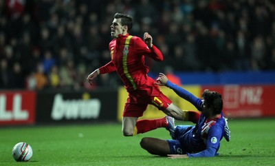 260313 - Wales v Croatia, World Cup Qualifier, Swansea - Wales' Gareth Bale is brought down by Croatia's Vedran Corluka