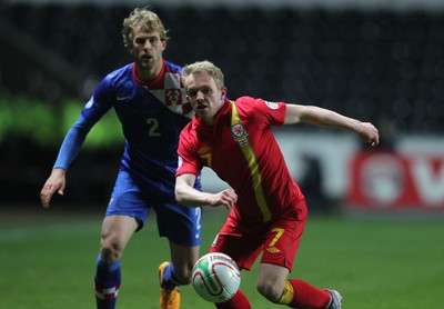 260313 - Wales v Croatia, World Cup Qualifier, Swansea - Wales' Jonathan Williams gets away from Croatia's Ivan Strinic