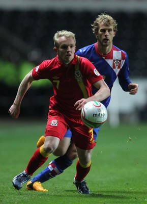 260313 - Wales v Croatia, World Cup Qualifier, Swansea - Wales' Jonathan Williams gets away from Croatia's Ivan Strinic