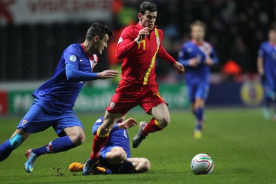 260313 - Wales v Croatia, World Cup Qualifier, Swansea - Wales' Gareth Bale is brought down by Croatia's Mateo Kovacic