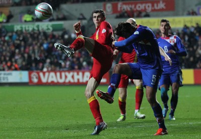 260313 - Wales v Croatia, World Cup Qualifier, Swansea - Wales' Gareth Bale and Croatia's Vedran Corluka compete for the ball