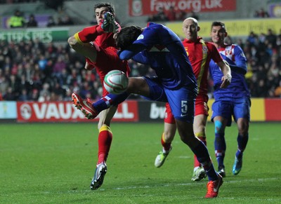 260313 - Wales v Croatia, World Cup Qualifier, Swansea - Wales' Gareth Bale and Croatia's Vedran Corluka compete for the ball