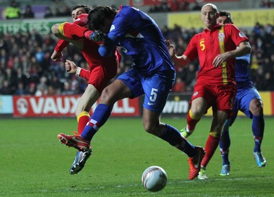 260313 - Wales v Croatia, World Cup Qualifier, Swansea - Wales' Gareth Bale and Croatia's Vedran Corluka compete for the ball